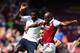 LONDON, ENGLAND - MAY 03: Emmanuel Adebayor of Spurs and Carlton Cole of West Ham compete for the ball during the Barclays Premier League match between West Ham United and Tottenham Hotspur at Boleyn Ground on May 3, 2014 in London, England. (Photo by B