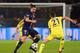 PARIS, FRANCE - FEBRUARY 17: Zlatan Ibrahimovic of Paris Saint-Germain takes on Nemanja Matic of Chelsea during the UEFA Champions League Round of 16 match between Paris Saint-Germain and Chelsea at Parc des Princes on February 17, 2015 in Paris, France.