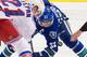 VANCOUVER, BC - DECEMBER 13: Derek Stepan #21 of the New York Rangers and Henrik Sedin #33 of the Vancouver Canucks face-off during NHL action at Rogers Arena on December 13, 2014 in Vancouver, British Columbia, Canada. (Photo by Rich Lam/Getty Images)