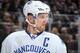 NEW YORK, NY - FEBRUARY 19: Henrik Sedin #33 of the Vancouver Canucks looks on during a face-off against the New York Rangers at Madison Square Garden on February 19, 2015 in New York City. The Vancouver Canucks won 5-4 in a shootout. (Photo by Jared Sil