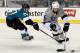 SANTA CLARA, CA - FEBRUARY 21: Jake Muzzin #6 of the Los Angeles Kings handles the puck away from Tommy Wingels #57 of the San Jose Sharks during the second period of the 2015 Coors Light NHL Stadium Series game at Levi's Stadium on February 21, 2015 in