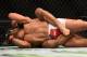 LOS ANGELES, CA - FEBRUARY 28: (Behind) Roan Carneiro submits Mark Munoz in their middleweight bout during the UFC 184 event at Staples Center on February 28, 2015 in Los Angeles, California. (Photo by Harry How/Getty Images)