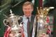 12th May 1996; Manchester United manager Alex Ferguson with the FA Cup and Premiership trophy on his arrival at Manchester's Victoria station. Mandatory Credit: Shaun Botterill/ALLSPORT