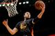 OAKLAND, CA - MARCH 4: Andrew Bogut #12 of the Golden State Warriors grabs a rebound against the Milwaukee Bucks on March 4, 2015 at Oracle Arena in Oakland, California. NOTE TO USER: User expressly acknowledges and agrees that, by downloading and or usin