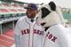 Nov 25, 2014; Boston, Ma, USA; A man in a panda costume greets Boston Red Sox third baseman Pablo Sandoval after the introductory press conference at Fenway Park. Mandatory Credit: Greg M. Cooper-USA TODAY Sports