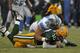 GREEN BAY, WI - JANUARY 01: A penalty flag flies over the head of Ndamukong Suh #90 of the Detroit Lions as he sacks Matt Flynn #10 of the Green Bay Packers at Lambeau Field on January 1, 2012 in Green Bay, Wisconsin. The Packers defeated the Lions 45-41.