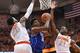 Feb 14, 2015; Syracuse, NY, USA; Duke Blue Devils forward Justise Winslow (12) drives to the basket between Syracuse Orange forwards Rakeem Christmas (25) and forward Tyler Roberson (21) during the second half at the Carrier Dome. Duke defeated Syracuse