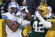 GREEN BAY, WI - DECEMBER 28: Morgan Burnett #42 of the Green Bay Packers breaks up a pass intended Eric Ebron #85 of the Detroit Lions in the second quarter at Lambeau Field on December 28, 2014 in Green Bay, Wisconsin. (Photo by Chris Graythen/Getty I