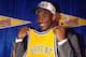 INGLEWOOD, CA - JULY 11: Kobe Bryant holds a #8 Los Angeles Lakers jersey after being the 13th overall pick in the 1996 NBA Draft by the Charlotte Hornets who then traded his draft rights to the Los Angeles Lakers on July 11, 1996 in Inglewood, Californi