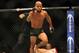 Sep 27, 2014; Las Vegas, NV, USA; Demetrious Johnson (red gloves) celebrates after referee Herb Brooks stops a featherweight title bout against Chris Cariaso (blue gloves) during UFC 178 at MGM Grand Garden Arena. Mandatory Credit: Stephen R. Sylvanie-USA