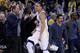 OAKLAND, CA - JANUARY 23: Stephen Curry #30 reacts after Klay Thompson #11 of the Golden State Warriors made a three-point basket in the third quarter of their game against the Sacramento Kings at ORACLE Arena on January 23, 2015 in Oakland, California.