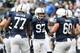Nov 2, 2013; University Park, PA, USA; Penn State Nittany Lions kicker Sam Ficken (97) is congratulated by teammates after kicking the extra point during overtime against the Illinois Fighting Illini at Beaver Stadium. Penn State defeated Illinois 24-17.
