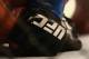 DALLAS, TX - MARCH 14: A detail of gloves worn by Anthony Pettis and Rafael dos Anjos in the Lightweight Title bout during the UFC 185 event at American Airlines Center on March 14, 2015 in Dallas, Texas. (Photo by Ronald Martinez/Getty Images)
