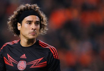 AMSTERDAM, NETHERLANDS - NOVEMBER 12:  Goalkeeper, Guillermo Ochoa of Mexico looks ot the ball during the international friendly match between Netherlands and Mexico held at the Amsterdam ArenA on November 12, 2014 in Amsterdam, Netherlands.  (Photo by De