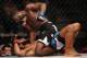 Jul 16, 2014; Atlantic City, NJ, USA; Aljamain Sterling pulls back for a punch while on top of a prone Hugo Viana (red gloves) during a bantamweight bout at Revel Casino. Mandatory Credit: Bill Streicher-USA TODAY Sports