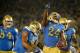 PASADENA, CA - SEPTEMBER 06: Paul Perkins #24 of the UCLA Bruins celebrates his 17 yard touchdown run to take a 6-0 lead over the Memphis Tigers during the first half at Rose Bowl on September 6, 2014 in Pasadena, California. (Photo by Harry How/Getty I