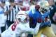 PASADENA, CA - NOVEMBER 28: Running back Paul Perkins #3 of the UCLA Bruins is pushed out of bounds by defensive back Jordan Richards #8 of the Stanford Cardinal at the Rose Bowl on November 28, 2014 in Pasadena, California. Stanford won 31-10. (Photo by