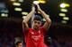 LIVERPOOL, ENGLAND - MAY 16: Steven Gerrard of Liverpool applauds the fans as he walks a lap of honour after his final game at Anfield during the Barclays Premier League match between Liverpool and Crystal Palace at Anfield on May 16, 2015 in Liverpool,