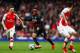 LONDON, ENGLAND - APRIL 04: Aaron Ramsey of Arsenal marshalls Raheem Sterling of Liverpool during the Barclays Premier League match between Arsenal and Liverpool at Emirates Stadium on April 4, 2015 in London, England. (Photo by Julian Finney/Getty Imag