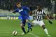 TURIN, ITALY - MARCH 09: Domenico Berardi (L) of US Sassuolo Calcio is challenged by Patrice Evra of Juventus FC during the Serie A match between Juventus FC and US Sassuolo Calcio at Juventus Arena on March 9, 2015 in Turin, Italy. (Photo by Valerio Pe