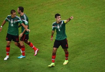 RECIFE, BRAZIL - JUNE 23:  Rafael Marquez of Mexico celebrates scoring his team's first goal during the 2014 FIFA World Cup Brazil Group A match between Croatia and Mexico at Arena Pernambuco on June 23, 2014 in Recife, Brazil.  (Photo by Laurence Griffit