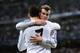 MADRID, SPAIN - MARCH 18: Cristiano Ronaldo of Real Madrid celebrates with teammate Gareth Bale after scoring his team's second goal during the UEFA Champions League Round of 16, second leg match between Real Madrid and FC Schalke 04 at Estadio Santiago