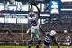 ARLINGTON, TX - DECEMBER 21: Dez Bryant #88 of the Dallas Cowboys goes up for the catch to score a touchdown as Greg Toler #28 of the Indianapolis Colts defends in the first half at AT&T Stadium on December 21, 2014 in Arlington, Texas. (Photo by Tom Pe