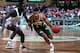 BOSTON - 1989: Dana Barros #11 of the Seattle SuperSonics drives to the basket against Kelvin Upshaw #7 of the Boston Celtics during a game played in 1989 at the Boston Garden in Boston, Massachusetts. NOTE TO USER: User expressly acknowledges and agrees