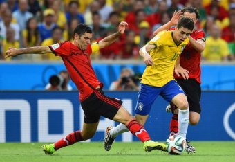 FORTALEZA, BRAZIL - JUNE 17: Rafael Marquez of Mexico challenges Oscar of Brazil during the 2014 FIFA World Cup Brazil Group A match between Brazil and Mexico at Castelao on June 17, 2014 in Fortaleza, Brazil.  (Photo by Buda Mendes/Getty Images)