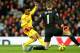 MANCHESTER, ENGLAND - DECEMBER 14: Dvid De Gea of Manchester United saves the attempt on goal of Raheem Sterling of Liverpool in a one on one situation during the Barclays Premier League match between Manchester United and Liverpool at Old Trafford on De