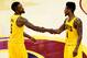 CLEVELAND, OH - MAY 24: J.R. Smith #5 and Iman Shumpert #4 of the Cleveland Cavaliers celebrate a three pointer by Smith in the fourth quarter against the Atlanta Hawks during Game Three of the Eastern Conference Finals of the 2015 NBA Playoffs at Quicke