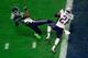GLENDALE, AZ - FEBRUARY 01: Malcolm Butler #21 of the New England Patriots intercepts a pass by Russell Wilson #3 of the Seattle Seahawks intended for Ricardo Lockette #83 late in the fourth quarter during Super Bowl XLIX at University of Phoenix Stadiu