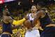 Jun 14, 2015; Oakland, CA, USA; Golden State Warriors guard Stephen Curry (30) fights for a loose ball with Cleveland Cavaliers forward LeBron James (23) and Cleveland Cavaliers center Tristan Thompson (13) during the third quarter in game five of the NBA