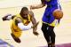 CLEVELAND, OH - JUNE 11: LeBron James #23 of the Cleveland Cavaliers falls to the court as Andre Iguodala #9 of the Golden State Warriors defends in the first quarter during Game Four of the 2015 NBA Finals at Quicken Loans Arena on June 11, 2015 in Clev
