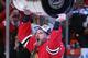 CHICAGO, IL - JUNE 15: Duncan Keith #2 of the Chicago Blackhawks celebrates by hoisting the Stanley Cup after defeating the Tampa Bay Lightning by a score of 2-0 in Game Six to win the 2015 NHL Stanley Cup Final at the United Center on June 15, 2015 in