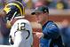 ANN ARBOR, MI - APRIL 04: Head coach Jim Harbaugh of the Michigan Wolverines talks with Alex Malzone #12 during the Michigan Football Spring Game on April 4, 2015 at Michigan Stadium in Ann Arbor, Michigan. (Photo by Gregory Shamus/Getty Images)