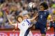 MONTREAL, QC - JUNE 21: Yoo Younga #12 of Korea Republic and Wendie Renard #2 of France jump for the ball during the 2015 FIFA Women's World Cup Round of 16 match at Olympic Stadium on June 21, 2015 in Montreal, Quebec, Canada. (Photo by Minas Panagiota