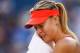 INDIAN WELLS, CA - MARCH 14: Maria Sharapova of Russia wipes her face against Yanina Wickmayer of Belgium during day six of the BNP Paribas Open tennis at the Indian Wells Tennis Garden on March 14, 2015 in Indian Wells, California. (Photo by Julian Fin