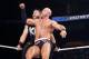 Cesaro crashes into Kevin Owens.