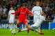 MADRID, SPAIN - NOVEMBER 04: Sergio Ramos of Real Madrid CF tackles Fabio Borini of Liverpool during the UEFA Champions League Group B match between Real Madrid CF and Liverpool FC at Estadio Santiago Bernabeu on November 4, 2014 in Madrid, Spain. (Phot
