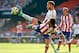 VALENCIA, SPAIN - OCTOBER 04: Arda Turan (R) of Atletico de Madrid is tackled by Shkodran Mustafi of Valencia during the La Liga match between Valencia CF and Club Atletico de Madrid at Estadi de Mestalla on October 4, 2014 in Valencia, Spain. (Photo by