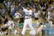 LOS ANGELES, CA - JUNE 19: Justin Turner #10 of the Los Angeles Dodgers signals to Adrian Gonzalez #23 after Turner scored on Gonzalez' single in the third inning against the San Francisco Giants at Dodger Stadium on June 19, 2015 in Los Angeles, Californ