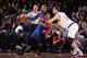 NEW YORK, NY - APRIL 15: Greg Monroe #10 of the Detroit Pistons handles the ball against Jason Smith #14 of the New York Knicks on April 15, 2015 at Madison Square Garden in New York City. NOTE TO USER: User expressly acknowledges and agrees that, by do