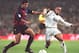 Figo in action for Barca against Madrid's Roberto Carlos