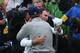 ST ANDREWS, SCOTLAND - JULY 20: Zach Johnson of the United States celebrates with Jordan Spieth of the United States after winning the 144th Open Championship at The Old Course during a 4-hole playoff on July 20, 2015 in St Andrews, Scotland. (Photo by