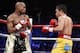 Floyd Mayweather Jr. exchange punches with Manny Pacquiao during their welterweight unification championship bout, May 2, 2015 at MGM Grand Garden Arena in Las Vegas, Nevada. Mayweather defeated Pacquiao by unanimous decision. AFP PHOTO / JOHN GURZINKSI