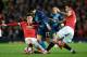 MANCHESTER, ENGLAND - MARCH 09: Alexis Sanchez of Arsenal is tackled by Ander Herrera of Manchester United and Angel di Maria of Manchester United during the FA Cup Quarter Final match between Manchester United and Arsenal at Old Trafford on March 9, 201