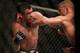 CHICAGO, IL - JULY 25: TJ Dillashaw (R) and Renan Barao fight in their UFC bantamweight championship bout during the UFC event at the United Center on July 25, 2015 in Chicago, Illinois. (Photo by \Rey Del Rio/Zuffa LLC/Zuffa LLC via Getty Images)