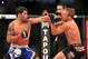 Oct 9, 2013; Barueri, Sao Paulo, Brazil; Raphael Assuncao (blue shorts) fights against TJ Dillashaw (black shorts) during UFC Fight Night 29 at Jose Correa Arena. Mandatory Credit: Jason Silva-USA TODAY Sports