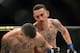 Apr 18, 2015; Newark, NJ, USA; Cub Swanson (red) and Max Holloway (blue) fight during UFC Fight Night at Prudential Center. Holloway won via third round tap out. Mandatory Credit: Joe Camporeale-USA TODAY Sports